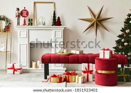 Stylish christmas composition at living room interior with white chimney, christmas tree and wreath, stars, gifts and decoration. Santa clause is coming. Template.