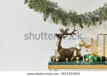 Christmas composition with beautiful decoration, christmas tree and wreath, deer, gifts and accessories in modern home decor. Template.