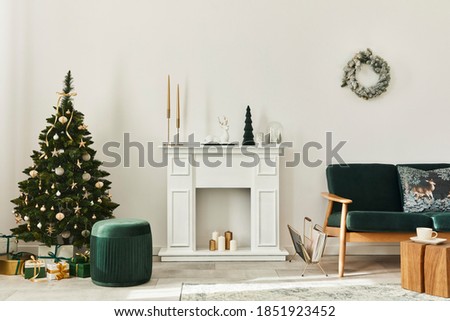 Stylish christmas living room interior with green sofa, white chimney, christmas tree and wreath, gifts and decoration. Santa claus is coming. Template.