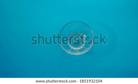 an empty bowl on blue background