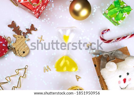 hourglass on the background of Christmas decorations