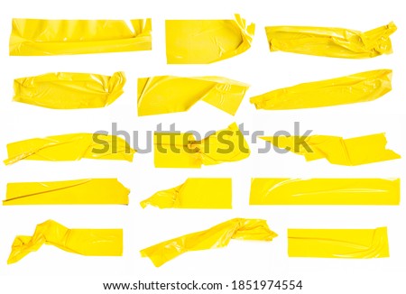 Set of yellow tapes on white background. Torn horizontal and different size yellow sticky tape, adhesive pieces. Royalty-Free Stock Photo #1851974554