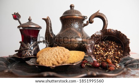 Oriental set for tea with biscuits.