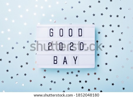 Lightbox with text GOOD BYE 2020 on blue background. Top view. New year celebration. Happy New Year 2021 concepts - Image