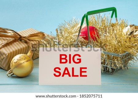Shopping basket and text BIG SALE on white paper note list. Shopping list concept.