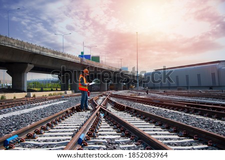 Asia construction worker on railways. Engineer work on railway with labor on background. rail, engineer, Infrastructure. Royalty-Free Stock Photo #1852083964