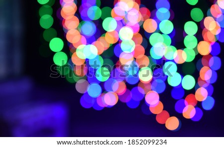 Dark with blurred colourful lights bokeh background