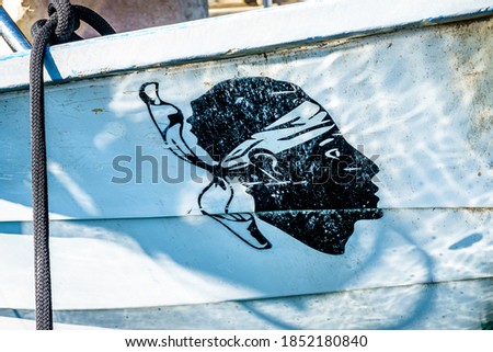the flag of corsica at a fishing boat