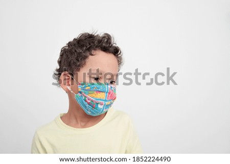 child wearing face masks protecting himself from coronavirus on white background stock photo