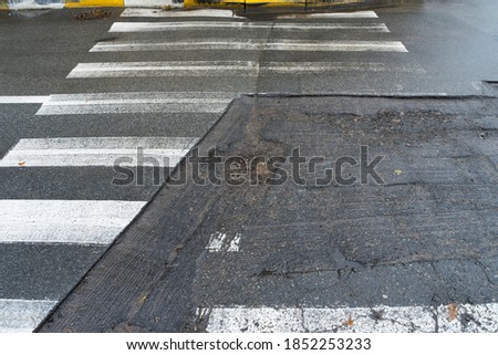 Partial repair crosswalk. Preparation for cladding of bad roads. 