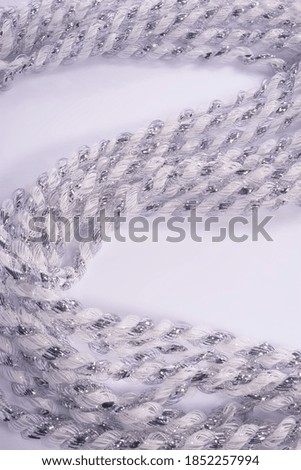 decorative Christmas silver shiny rain, on a white background