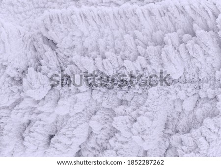 Surface covered with frozen snow. Close-up.