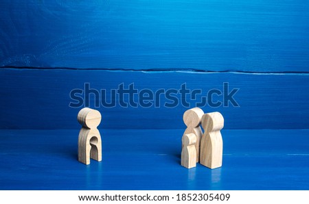 figurine with a void shape of a child and family of parents with a child. Surrogacy concept. Artificial insemination, bearing of children for childless families. Inability to have kids, infertility. Royalty-Free Stock Photo #1852305409