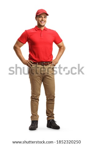 Full length portrait of a cheerul young male worker in a uniform posing isolated on white background Royalty-Free Stock Photo #1852320250