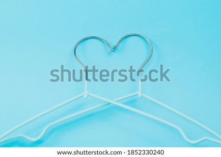 clothes hangers on a blue background
