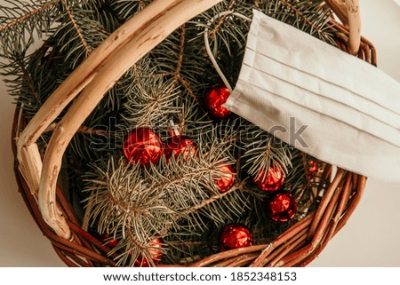 Happy new normal year 2021! Creative new year and coronavirus concept. Pine tree branches and mask in the wooden christmas pack. Christmas gift pack. Holidays, Congratulation concept.