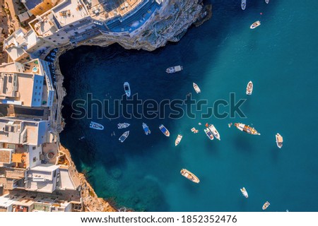 Aerial panoramic cityscape of Polignano a Mare town, Puglia region, Italy near Bari city, Europe. Superb scenic view of Adriatic sea. Traveling concept background.