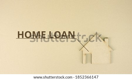 Paperboard house icon with HOME LOAN text