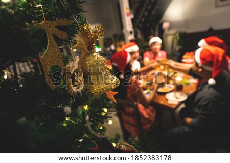 Group  people have a dinner christmas party at home. Royalty-Free Stock Photo #1852383178