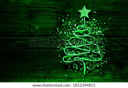 Sigh,symbol of Christmas Tree made from a lot colorful confetti, lace and red star toy on old retro vintage  wooden  background. Empty copy space for inscription. happy new 2021 year. holiday backdrop