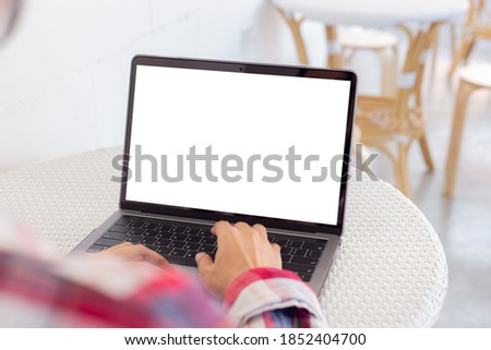 computer blank screen mockup.hand woman work using laptop with white background for advertising,contact business search information on desk at coffee shop.marketing and creative design
