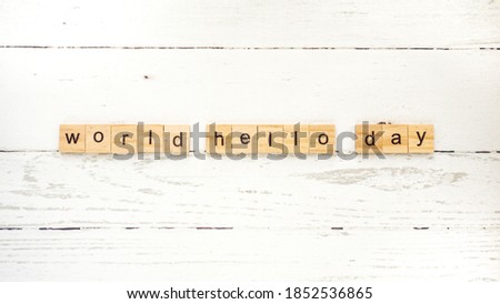 World Hello Day.words from wooden cubes with letters photo