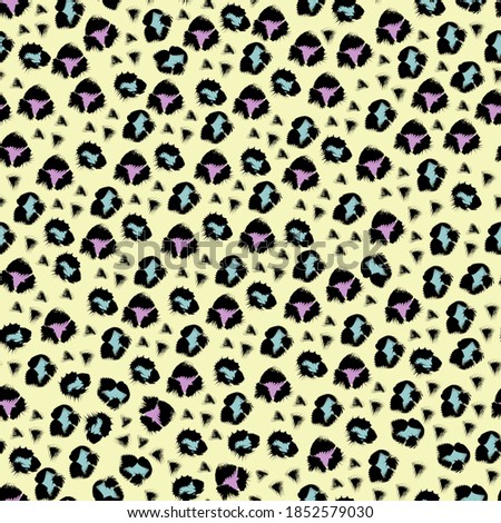 Seamless leopard pattern in vector. Pink and blue spots, imitation of wild animal fur on a yellow background, fabric, packaging