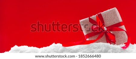 Christmas banner, red background with christmas gift and snow