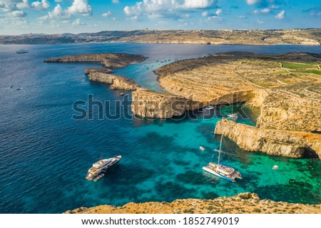 Aerial view of the famous Comino islan, Blue lagoon, tourist boats. Maltese island. Gozo on background Royalty-Free Stock Photo #1852749019