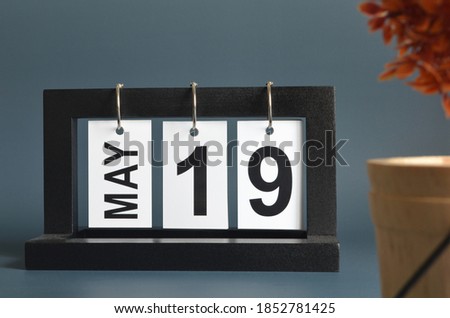 May 19, Date design with a black wooden calendar for a business, Date Plans to reminder.