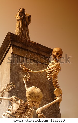 Halloween skeleton with statue