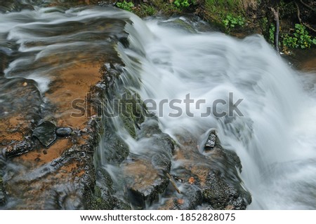 Spring landscape of Upper Wagner Falls captured with motion blur, Hiawatha National Forest, Michigan's Upper Peninsula, USA