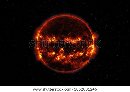 Sunspot And Solar Flare Activity. The sinister black sun in space. Sun on Halloween. Elements of this image furnished by NASA Royalty-Free Stock Photo #1852831246