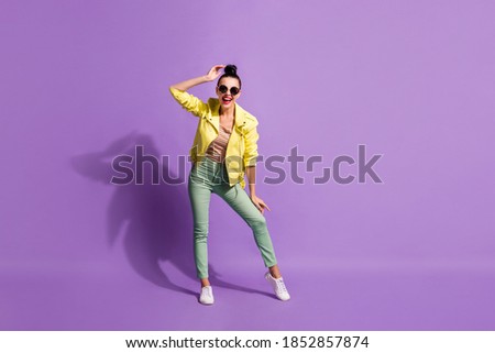 Full body photo of young attractive positive smile girl wear casual outfit happy smile enjoy isolated over purple color background
