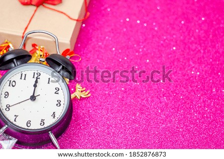 Midnight,black clock on pink background,Christmas concept