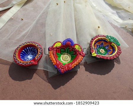 Close up of diyas with blurred natural background. Selective focus 