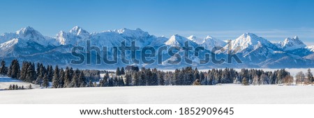 panoramic landscape at winter with alps mountains in Bavaria Royalty-Free Stock Photo #1852909645