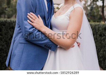 groom with bride together in autumn park wedding