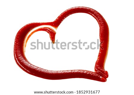 Decorative heart shaped frame of tomato sauce or ketchup on white with central copyspace symbolic of love