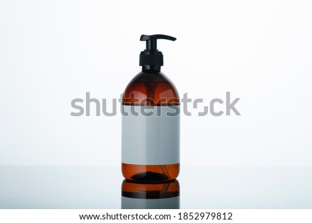 Liquid soap bottle with clean label on white and grey gradient background. Place for copy paste  text.  Royalty-Free Stock Photo #1852979812