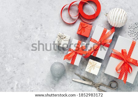 Making handmade gifts. Christmas composition with decorations. Gray grunge background. Top view, flat lay