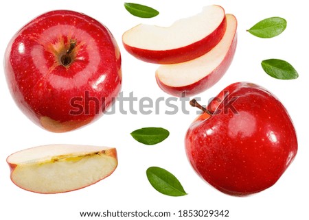 red apples with slices and green leaves isolated on a white background. top view