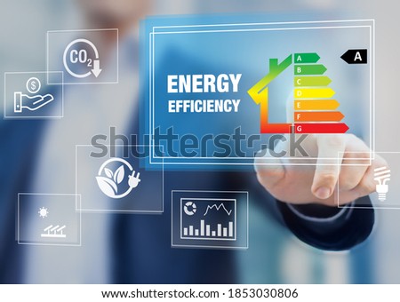 Energy efficiency rating and eco home renovation insulation performance, low consumption ecological house, sustainable development concept with expert touching icon on screen Royalty-Free Stock Photo #1853030806