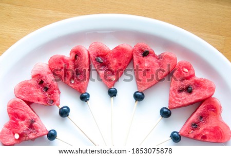 
Watermelon cut in the shape of hearts, on a plate as a delicious healthy snack Royalty-Free Stock Photo #1853075878