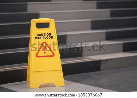 yellow sign of caution reserve cleaning on the wet floor