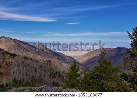 Butterfield Peak views of Oquirrh range toward Provo, Tooele, Utah Lake and Salt Lake County by Rio Tinto Bingham Copper Mine, in fall. Utah. United States.
