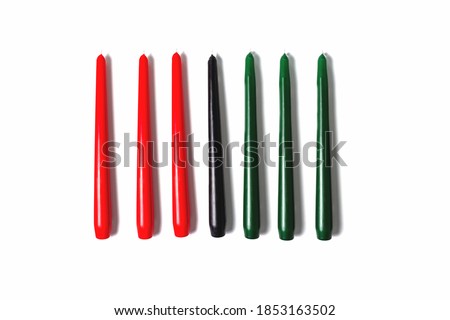 Kwanzaa candles on white background. Afro-American holiday. Seven candles as symbol of principles of African Heritage.