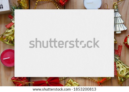 Empty white paper on Christmas and new year decorations on wooden floor and have copy space for design in your work.