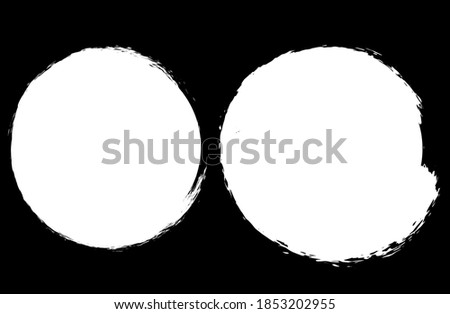 Round spots of white paint on a black background