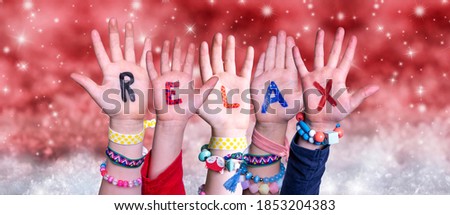 Children Hands Building Word Relax, Red Christmas Background